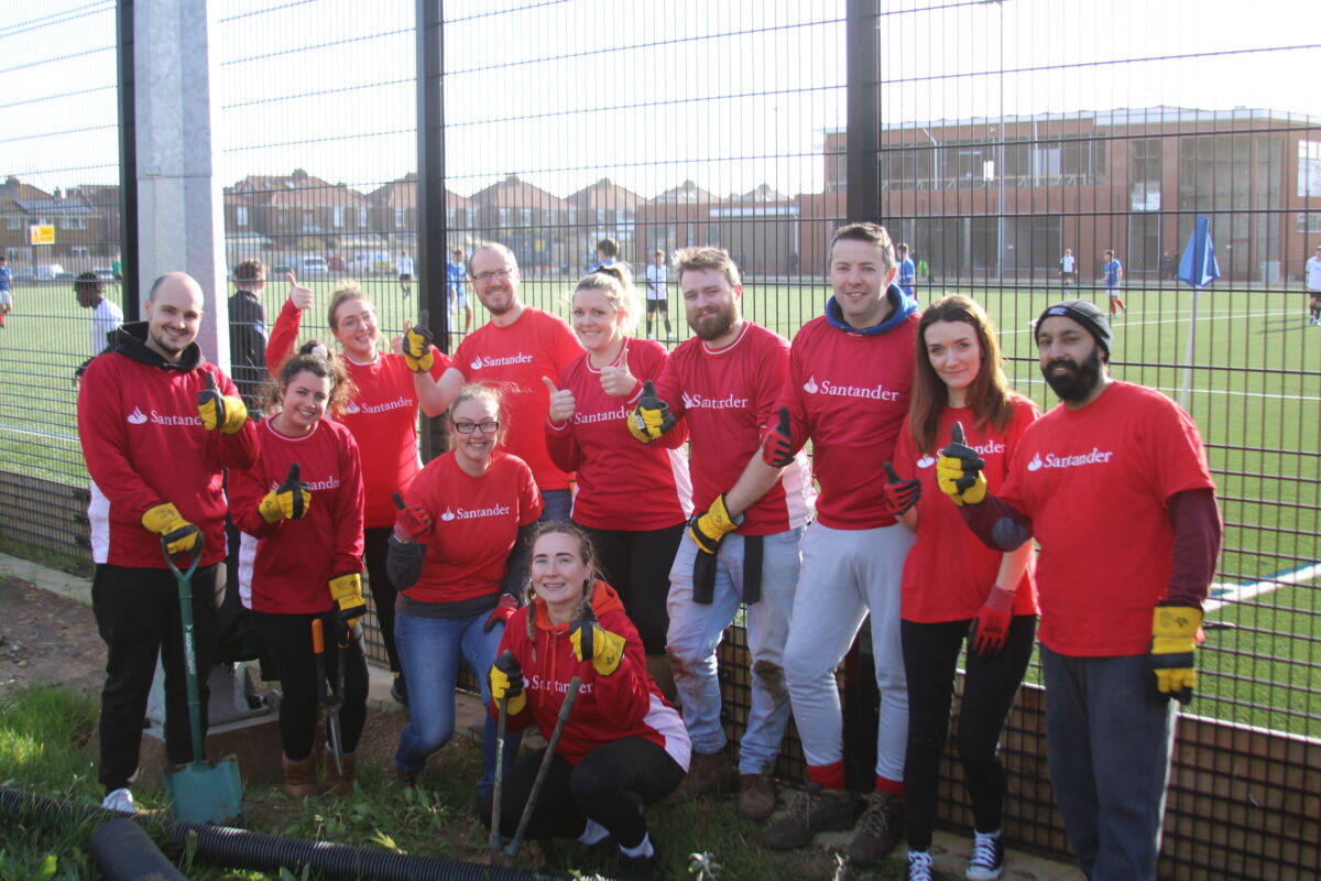 Santander staff volunteering at the John Jenkins Stadium